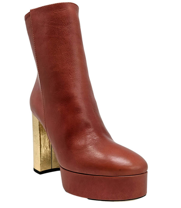 Dark red platform ankle boot with gold metallic heel, rounded toe