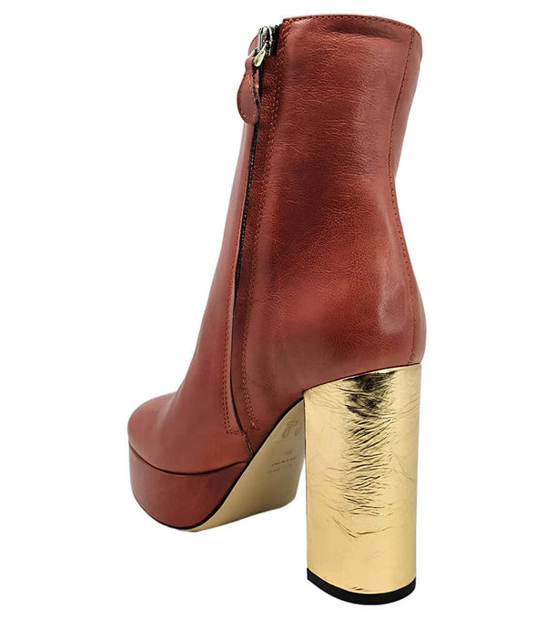 Dark red ankle boot with side zipper and gold metallic block heel