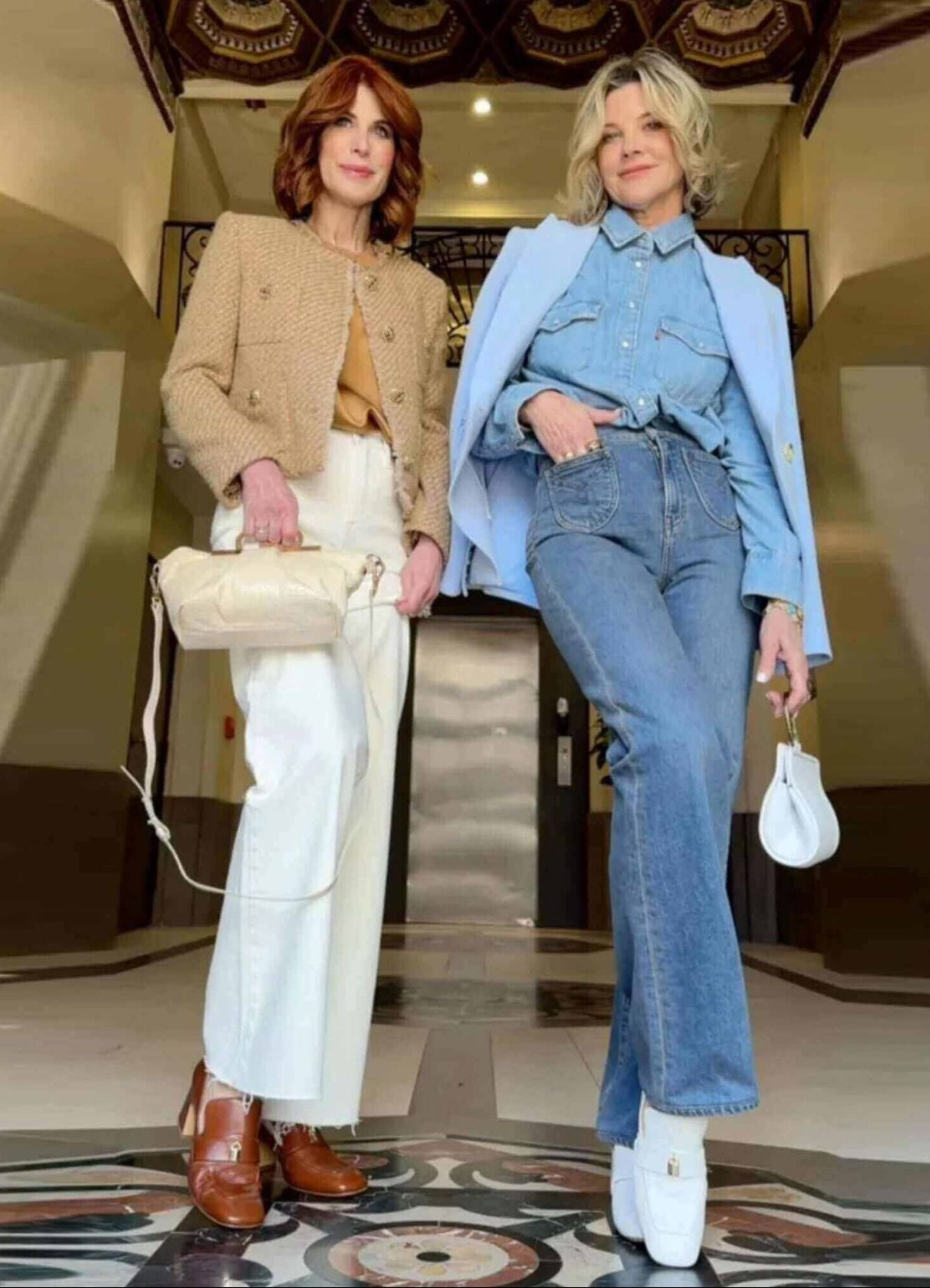 Two women in stylish outfits standing in a room with a Forbes logo.