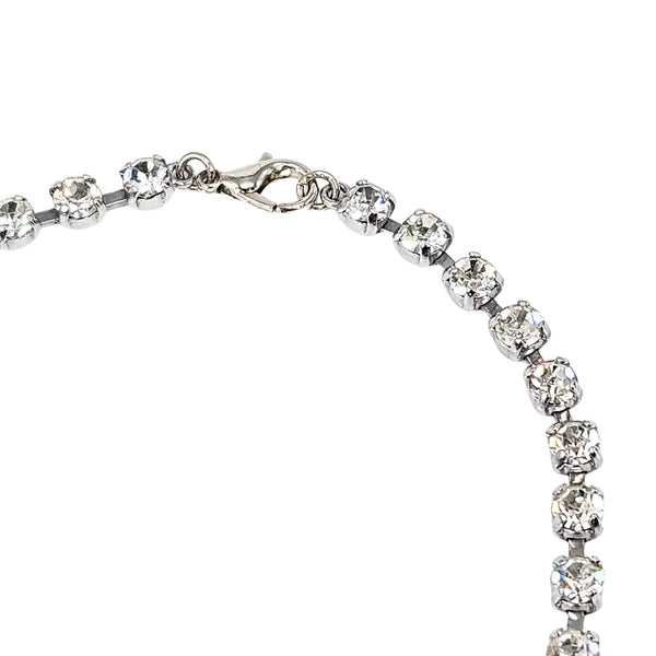 Rhinestone tennis-style necklace with round stones and silver-tone toggle clasp