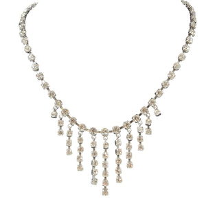 Rhinestone centerpiece necklace with curved neckline and multi-row fringe drop