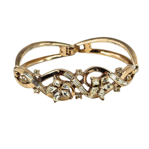 Gold rhinestone bracelet with flower motif and marquise and round crystal accents