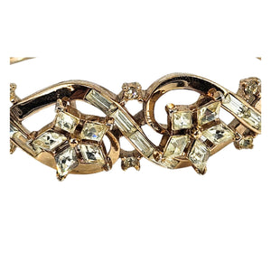 Gold rhinestone bracelet close-up with linked marquise and round crystal settings