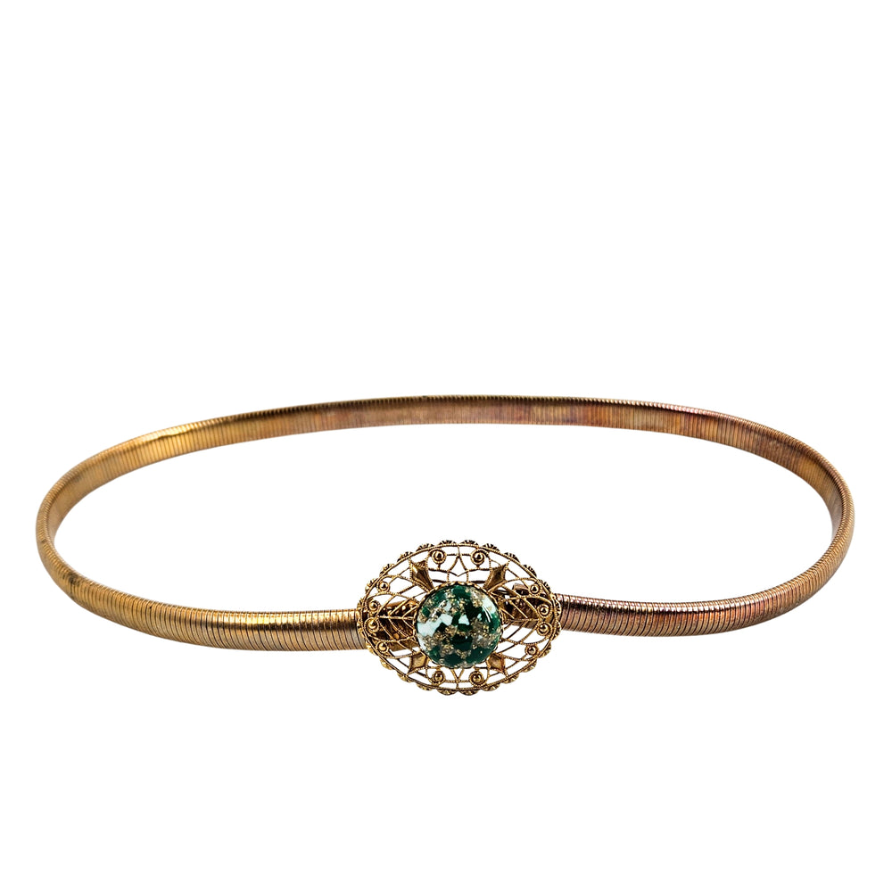 Gold-tone snake chain bracelet with filigree clasp and green gemstone