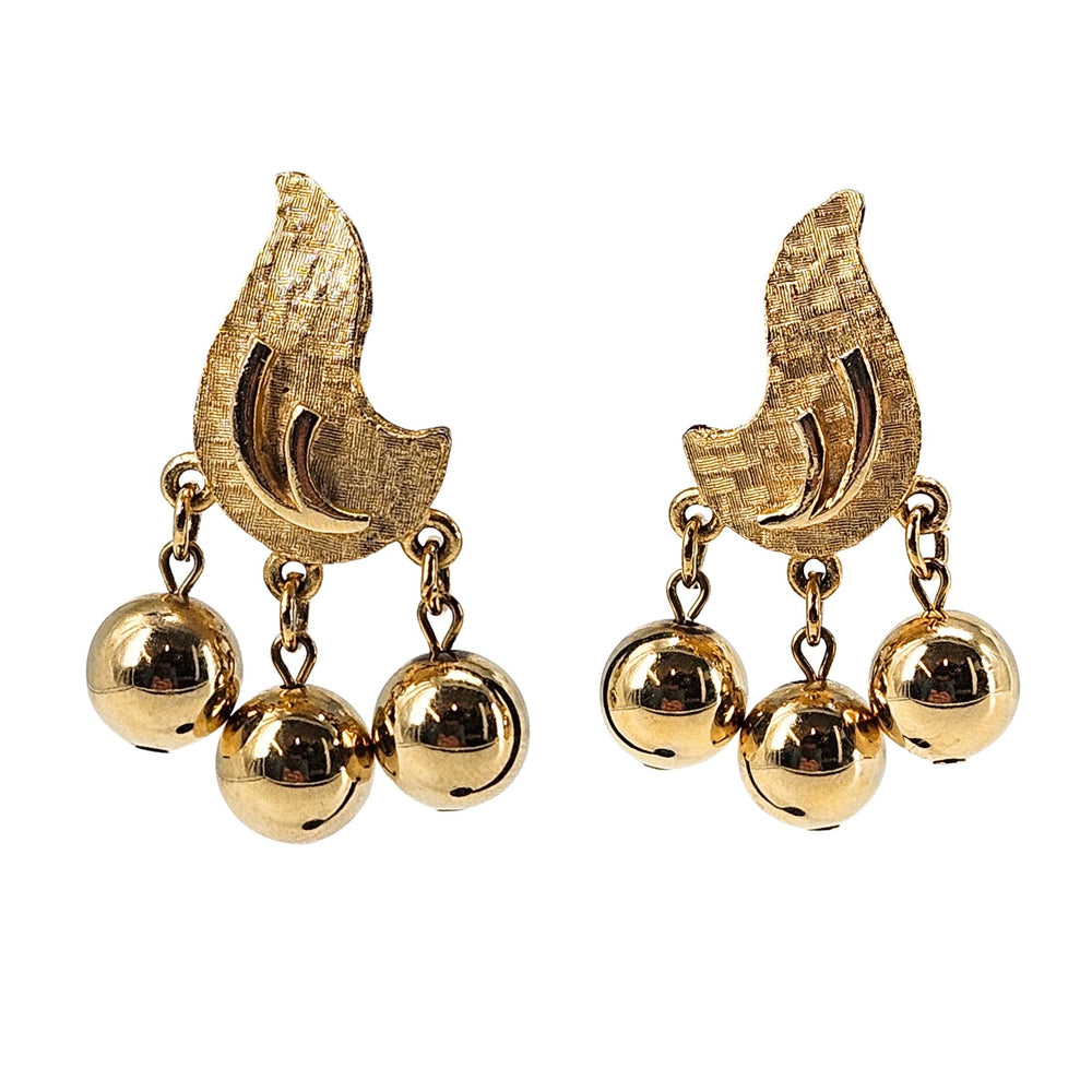 Pair of gold clip-on earrings with textured arcs and three dangling ball charms