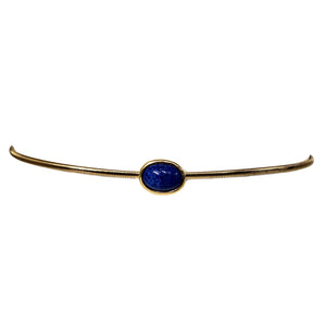 Gold stretch belt with blue oval stone centerpiece, thin flexible band
