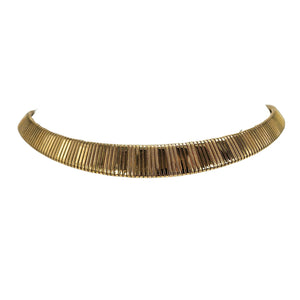Gold textured collar necklace with ribbed metal segments and curved arc shape