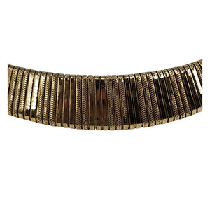 Gold textured collar necklace detail of ribbed panels and segmented links