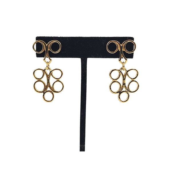 Gold tone dangle earrings on black card, circle links with top rings