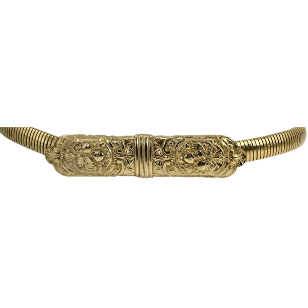 Gold stretch belt with decorative filigree center bar and ribbed metal-like ends