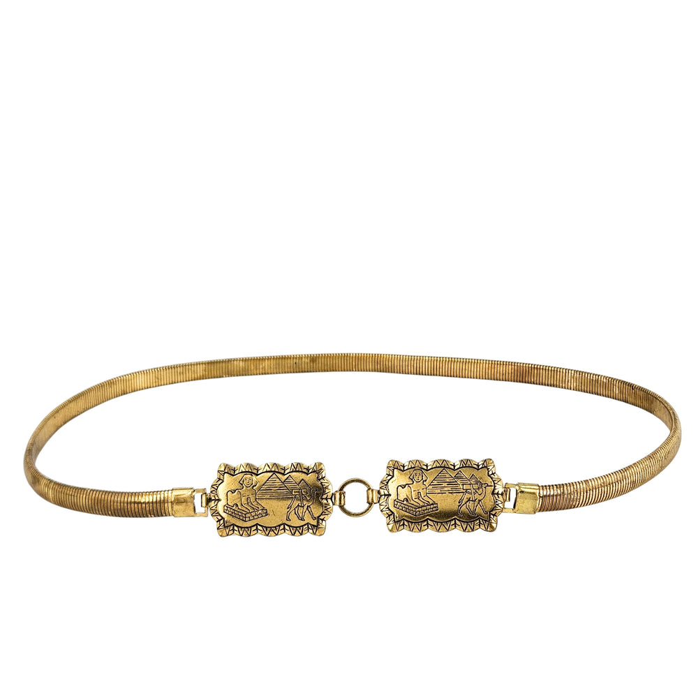 Gold stretch belt with Egyptian revival brass plaques and circular link clasp.