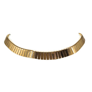 Gold-tone collar necklace close-up of curved segmented bar rows with open ends