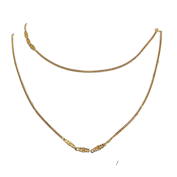 Gold-tone long station link chain necklace with curved silhouette and repeating stations