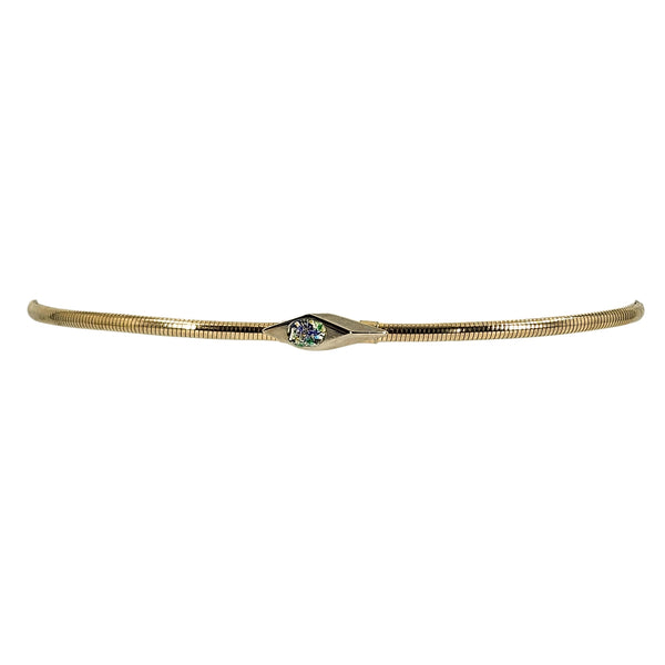 Gold-tone stretch snake chain belt shown straight, with a centered cabochon buckle