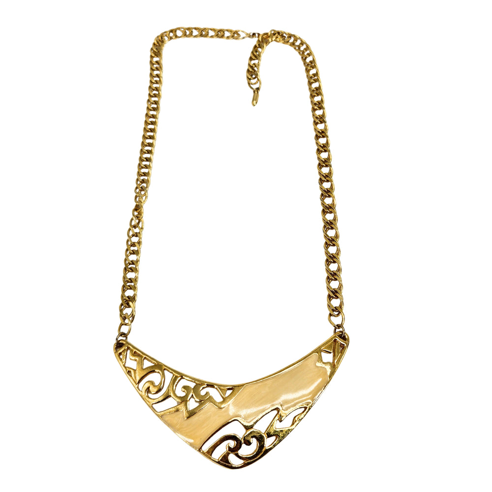 Gold-tone collar necklace with scalloped bib pendant and ornate scrollwork pattern