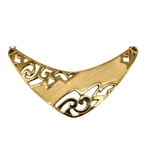 Gold-tone enamel bib pendant with arched scalloped edges and intricate scrollwork design