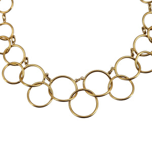 Close-up of gold circle-link chain necklace with interlocking ring links