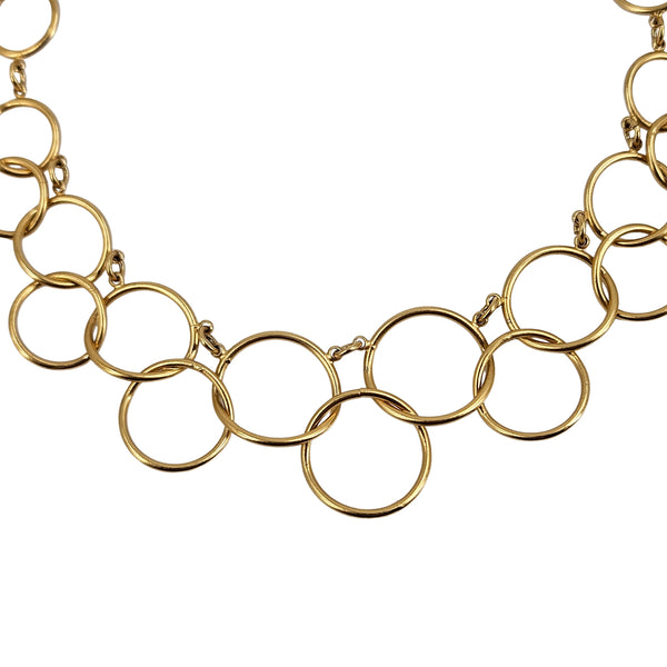 Close-up of gold circle-link chain necklace with interlocking ring links