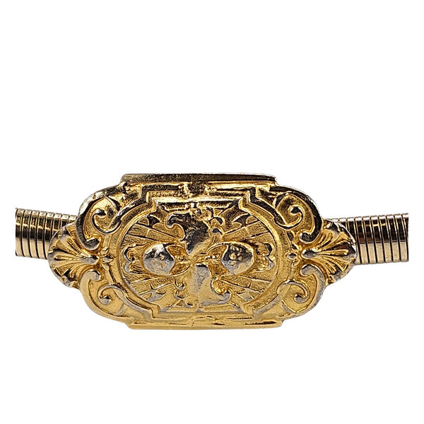 Gold baroque buckle close-up on snake-textured stretch belt with ribbed ends