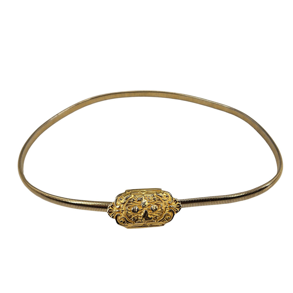 Gold stretch belt with ornate baroque oval buckle and gold snake-textured strap