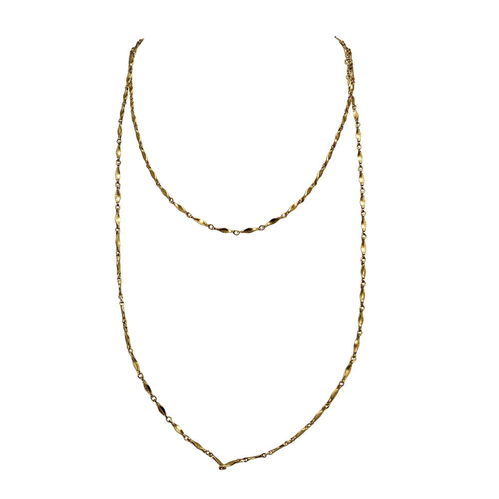 Gold tone long station chain necklace with teardrop links and center V drop