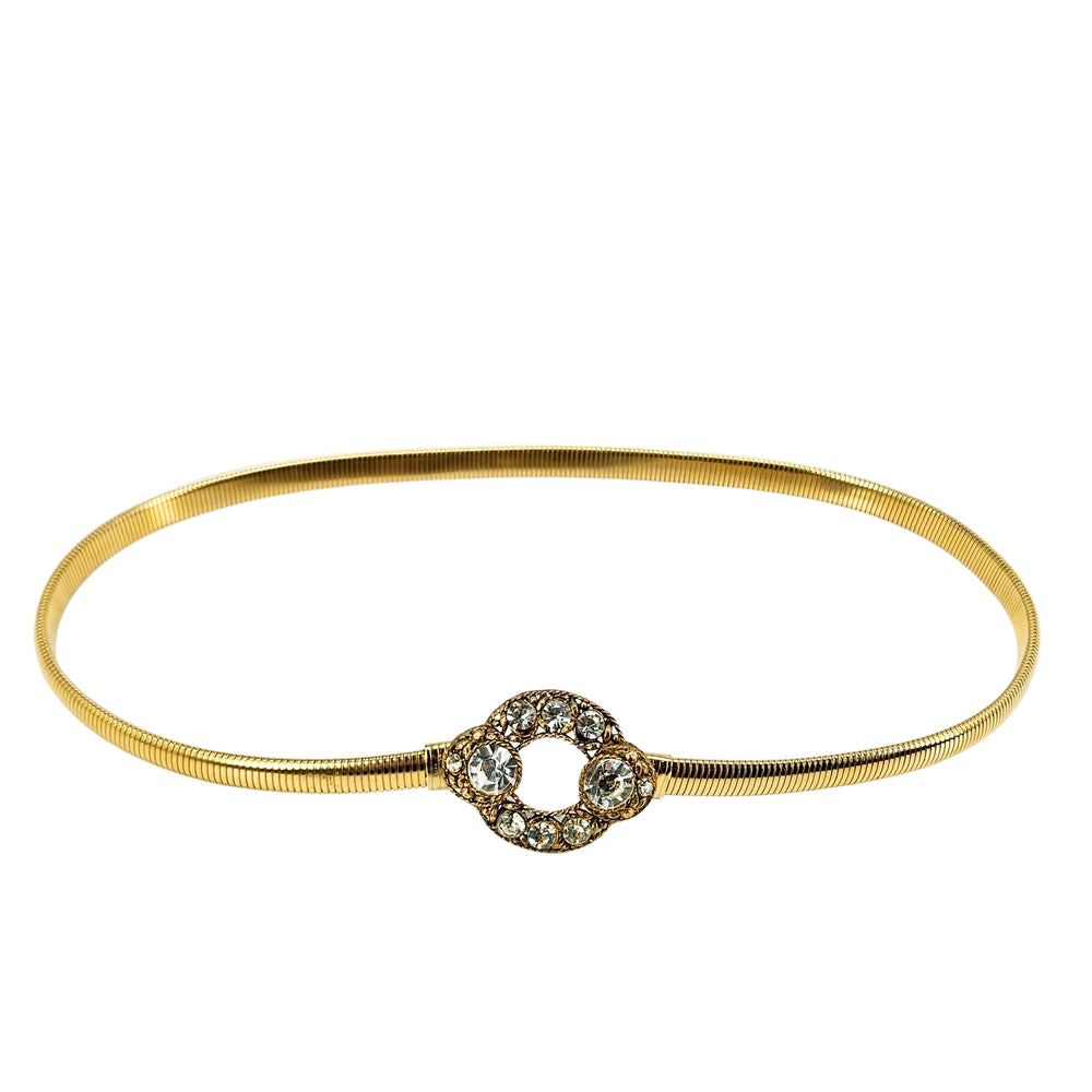 Gold tone stretch belt with oval circle buckle and faceted rhinestone accents