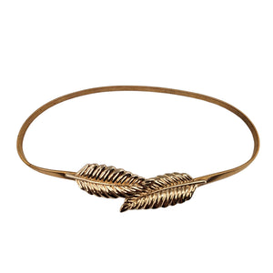 Gold leaf buckle belt with twisted metal center detail and slim strap