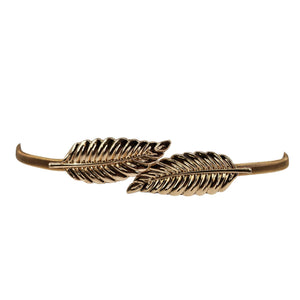 Gold metal leaf buckle belt with two leaf accents on a slim curved strap