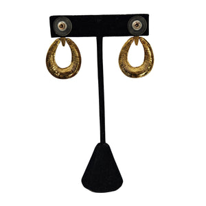 Gold-tone oval hoop earrings with textured finish