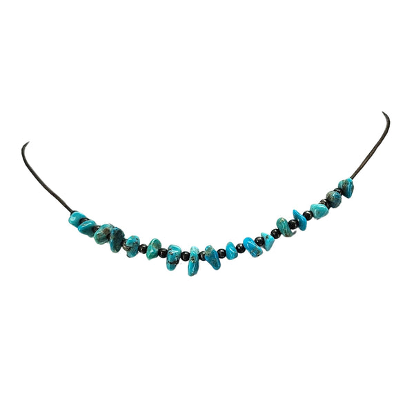 Turquoise howlite beaded necklace on dark cord with small metal clasp