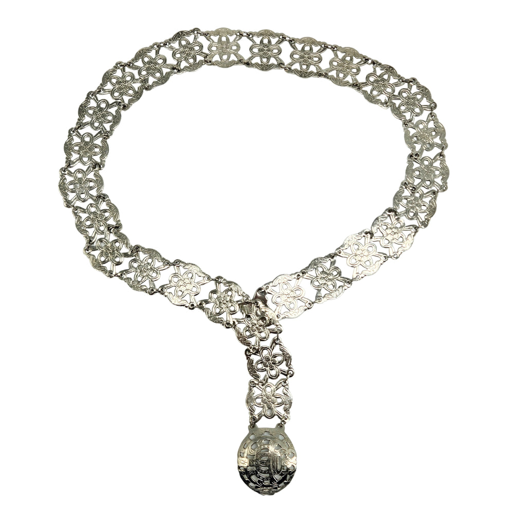 Silver filigree chain belt with ornate floral panel links and round clasp