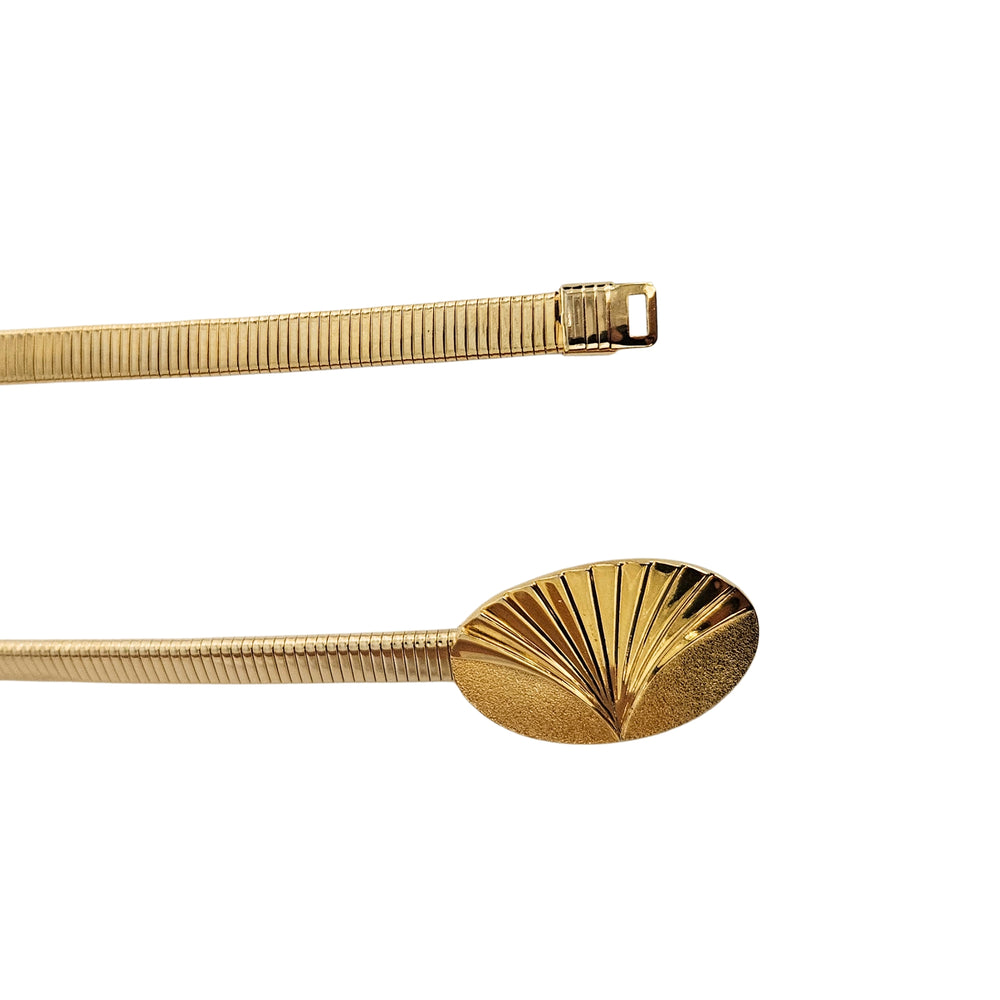Gold stretch belt with Art Deco fan disc center detail, curved flexible body