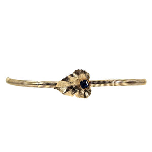 Gold tone stretch belt with leaf-and-snake centerpiece and blue gem