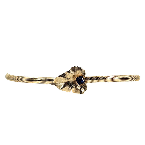 Gold tone stretch belt with leaf-and-snake centerpiece and blue gem