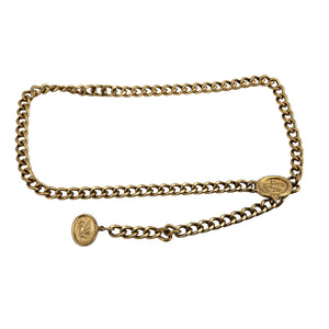 Gold chain belt with oval coin-style medallion buckle and linked waist chain
