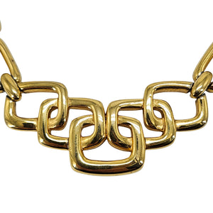 Gold choker necklace close-up of polished interlocking square links