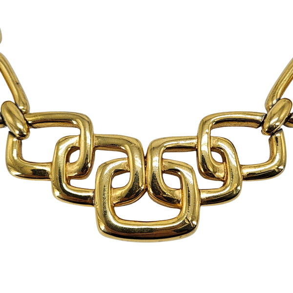 Gold choker necklace close-up of polished interlocking square links