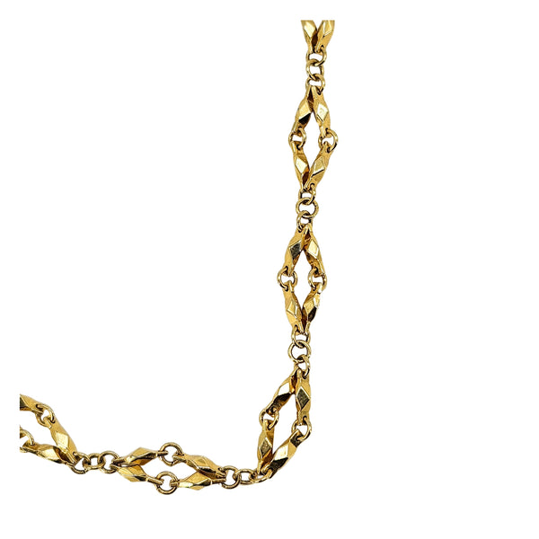 Gold diamond-link chain necklace side profile with faceted link segments