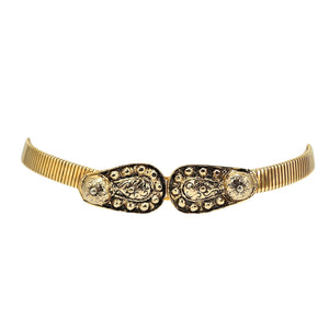 Gold-tone wide stretch belt with embossed oval buckle and sunburst accents