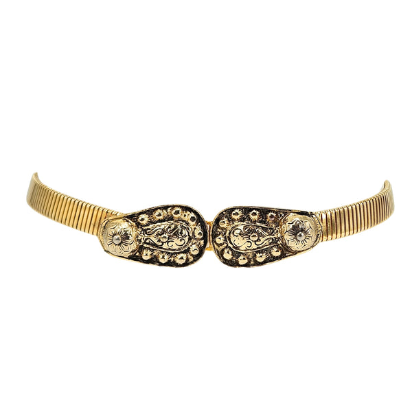 Gold-tone wide stretch belt with embossed oval buckle and sunburst accents