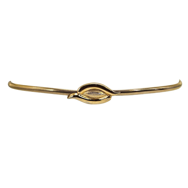Gold stretch skinny belt with central oval snake buckle, side angle