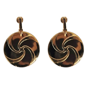 Gold clip-on earrings with round gold-and-black swirl discs and hinged posts