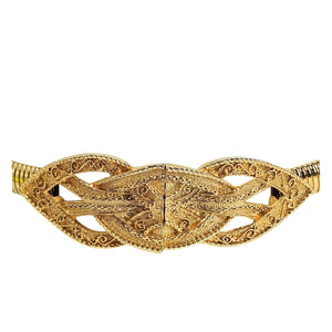 Gold stretch belt with decorative interlocking buckle and scrolled cutout design