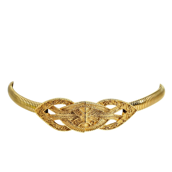 Gold stretch belt with curved interlocking filigree buckle, side profile view