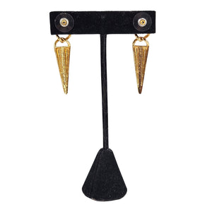 Gold-tone earrings with purple enamel shield accents and pointed teardrop dangles
