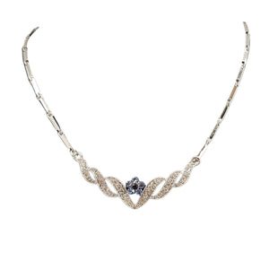 Silvertone rhinestone necklace with blue center stone and scalloped leaf-like links