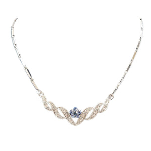 Silvertone rhinestone necklace with blue center stone and curved V-shaped front motif