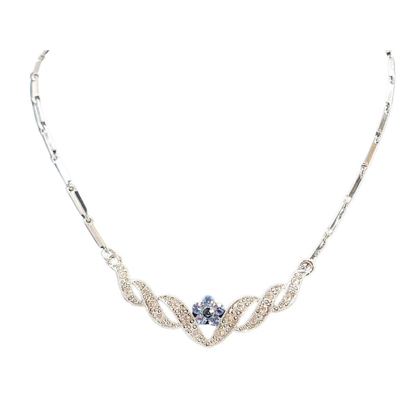 Silvertone rhinestone necklace with blue center stone and curved V-shaped front motif