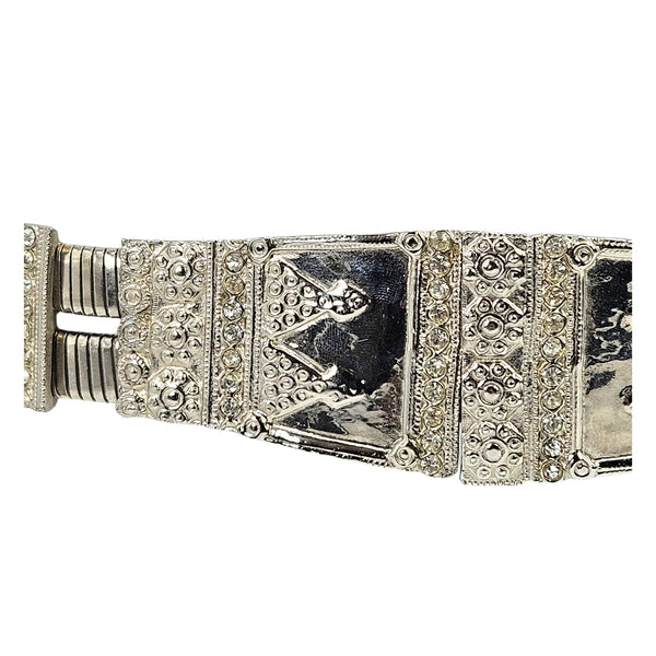 Silver stretch medium belt close-up: ornate textured center plate with dark enamel insets