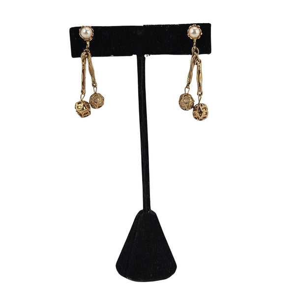 Gold filigree faux pearl dangle earrings with four-piece charm drops